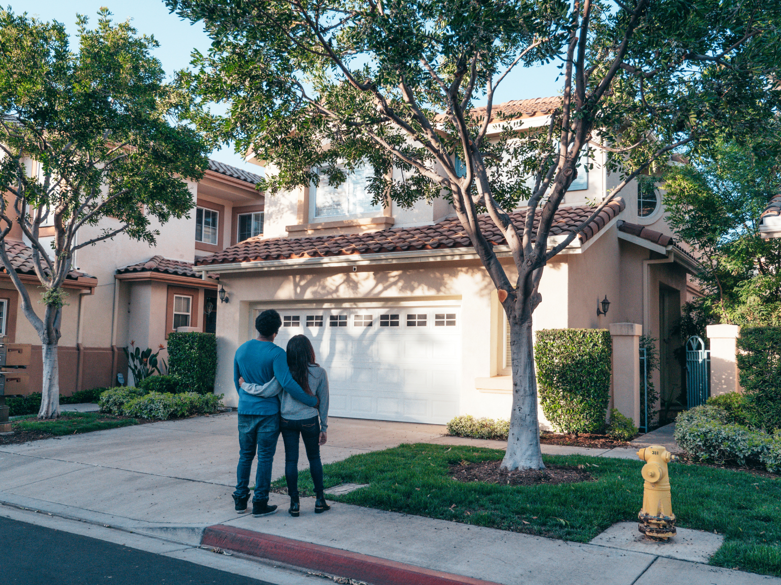 Loan officer discussing adjustable-rate mortgage options with clients